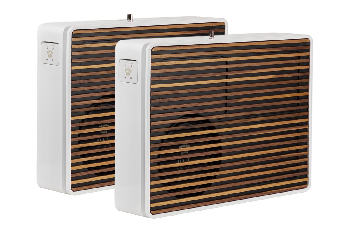 Two white subwoofers side by side with wood-slatted fronts