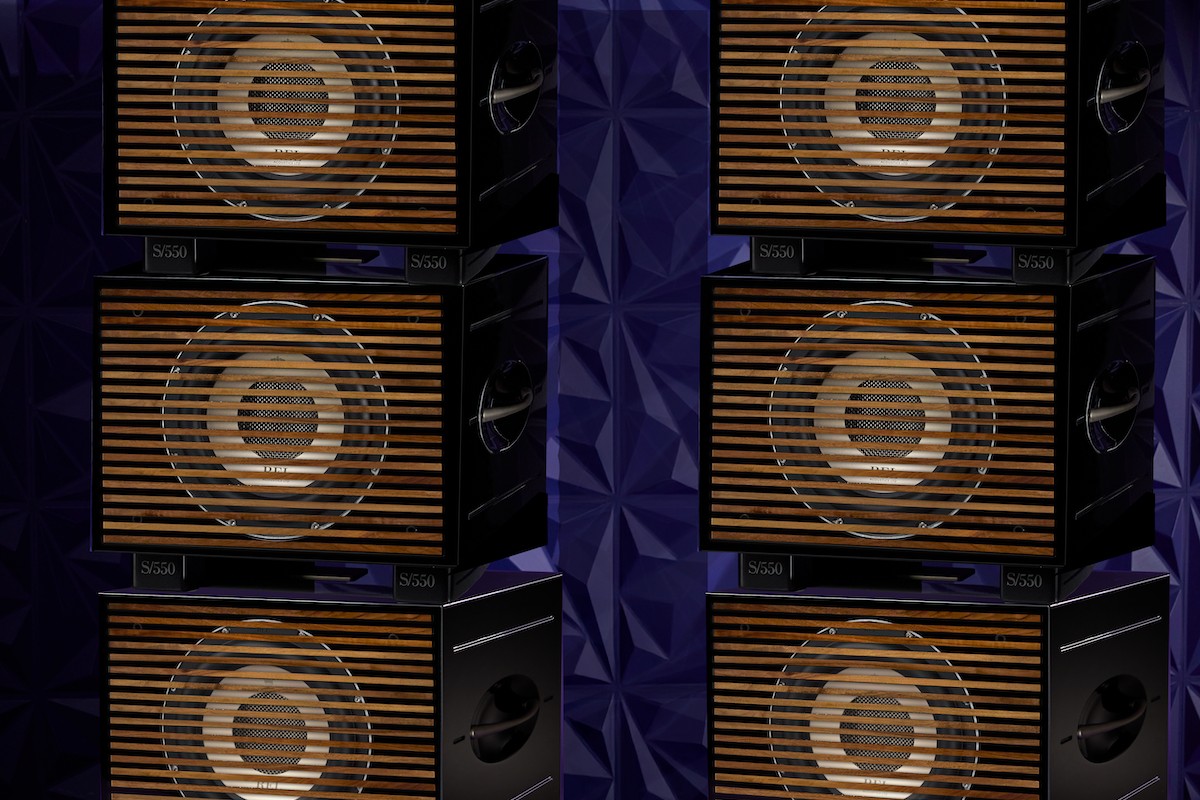 Six black subwoofers stacked in two columns with wood-slatted fronts