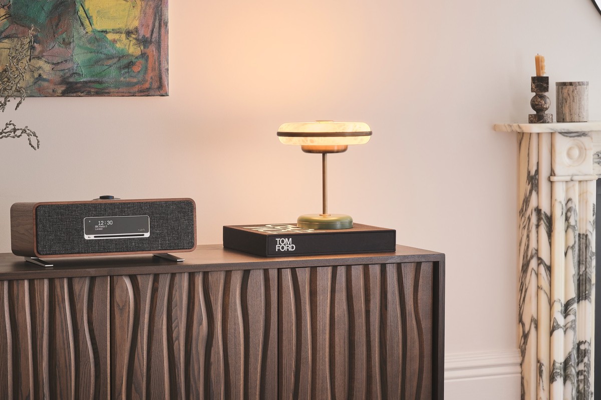 Compact unit on a carved sideboard, next to a marble fireplace