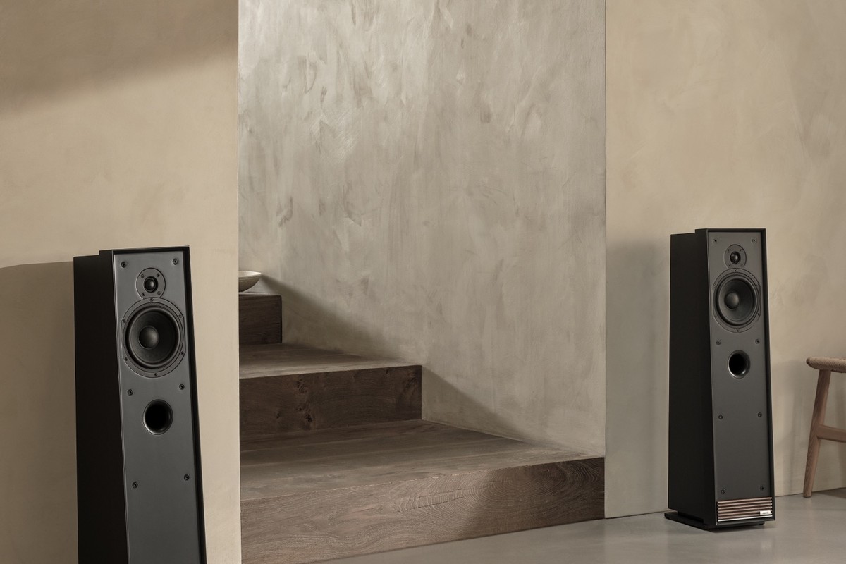 Pair of speakers in front of a polished concrete staircase