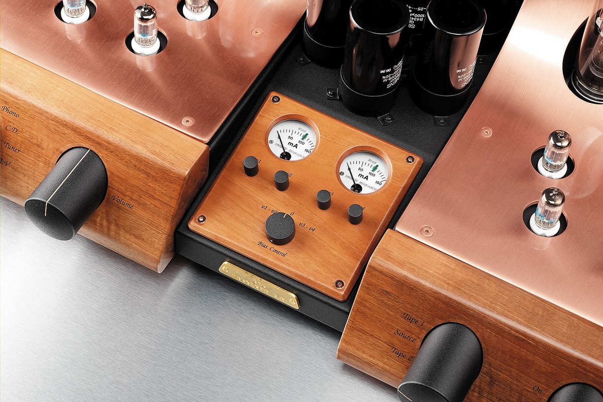 Central wooden module with two meters and adjustment knobs, between two copper blocks