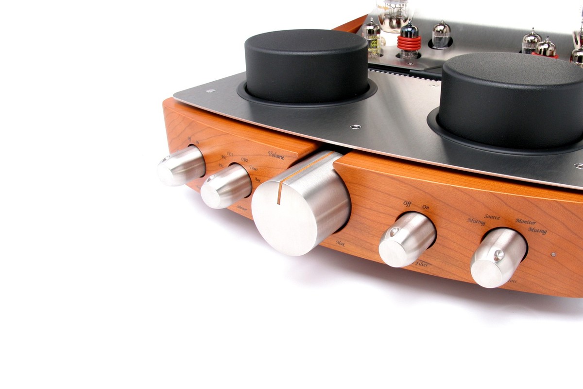 Wooden front with metal volume and selector knobs, close-up view