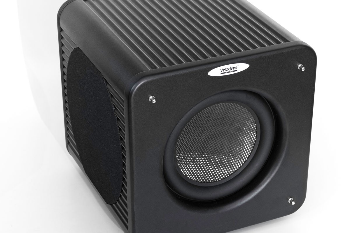 Black aluminium subwoofer seen three-quarters