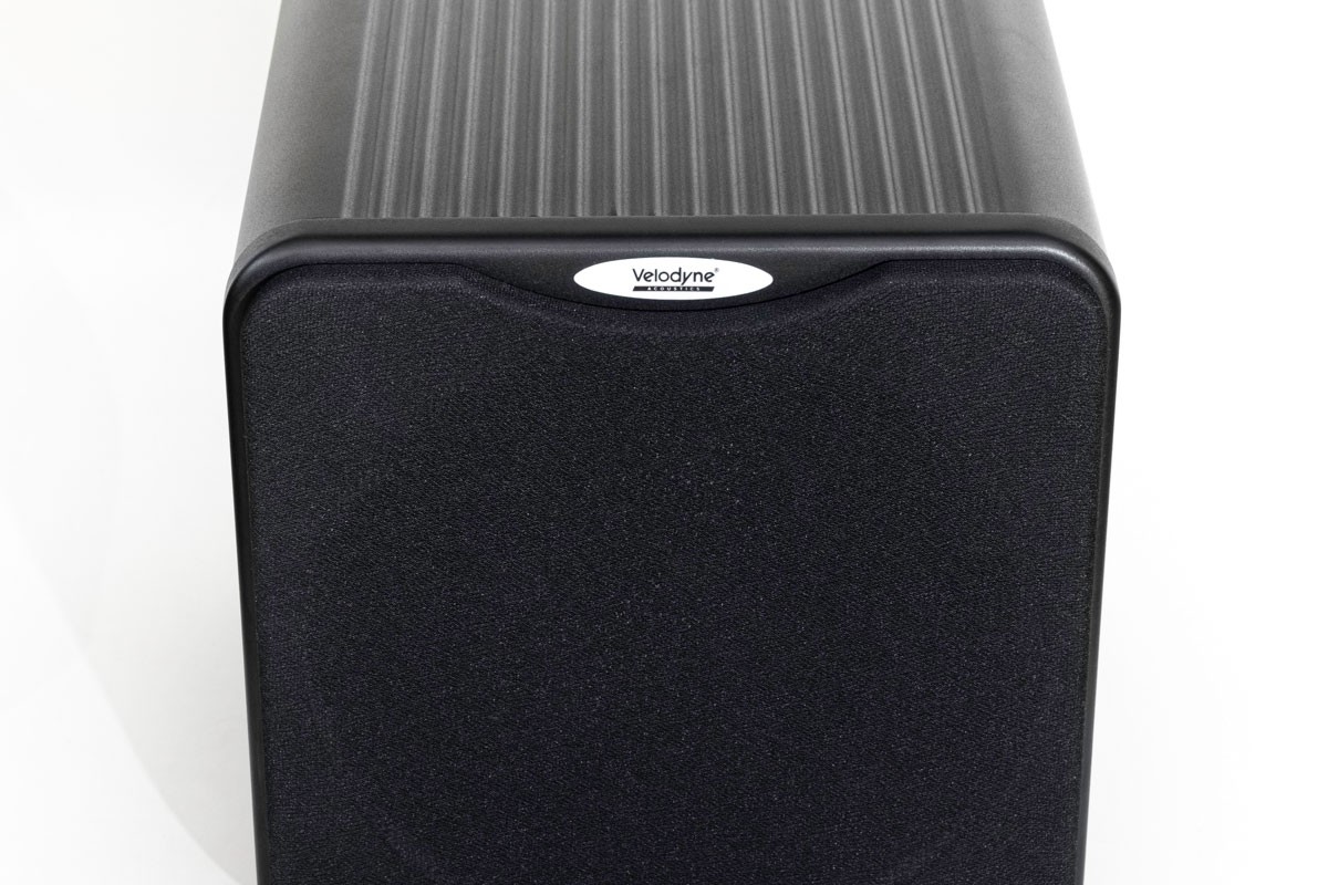 Black aluminium subwoofer with the grille fitted