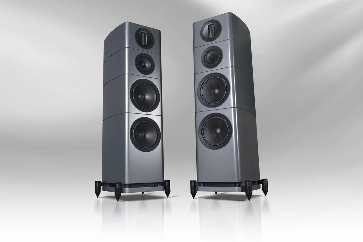Two grey towers seen from the front on a light background, showing their two woofers, midrange driver and tweeter