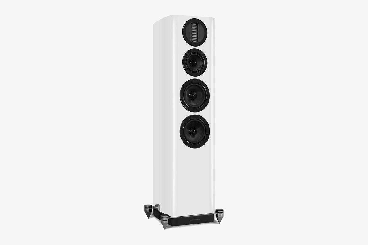 Hi-gloss white floorstanding speaker seen from three-quarter angle, AMT tweeter at the top of the front baffle