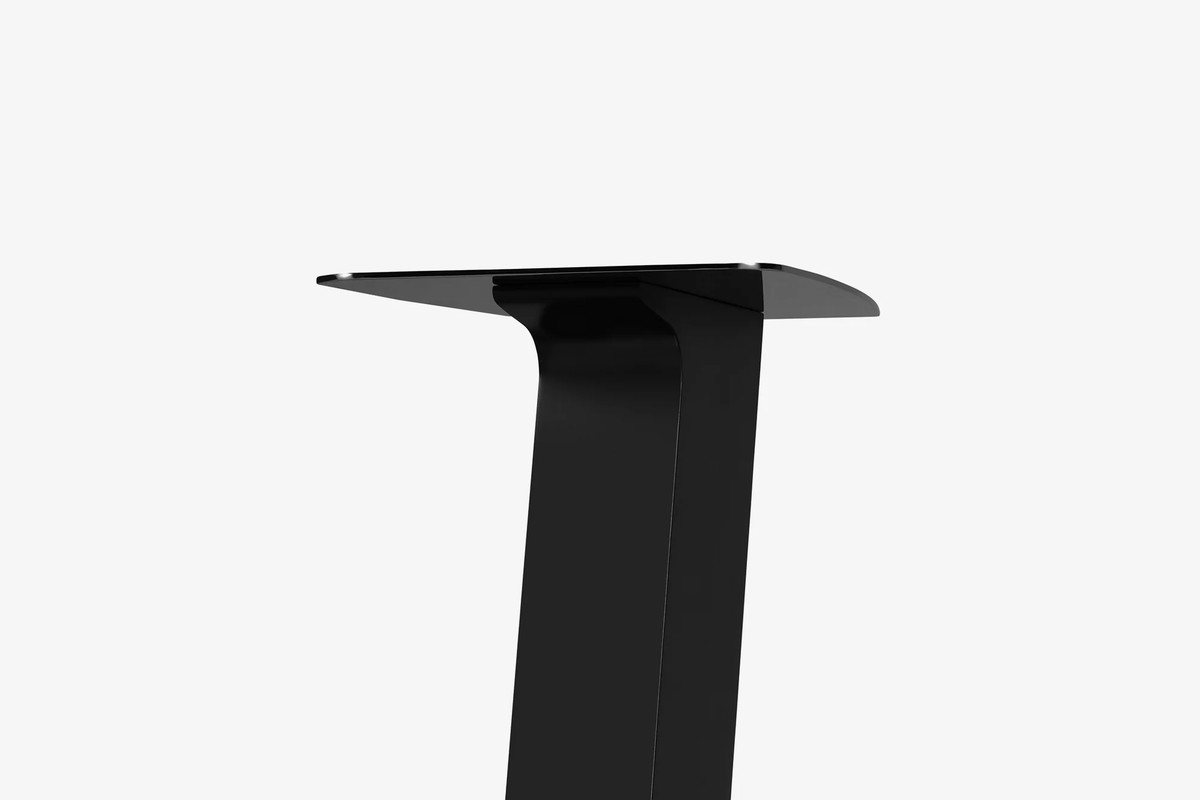 Black steel top plate and upper column of a stand, three-quarter view