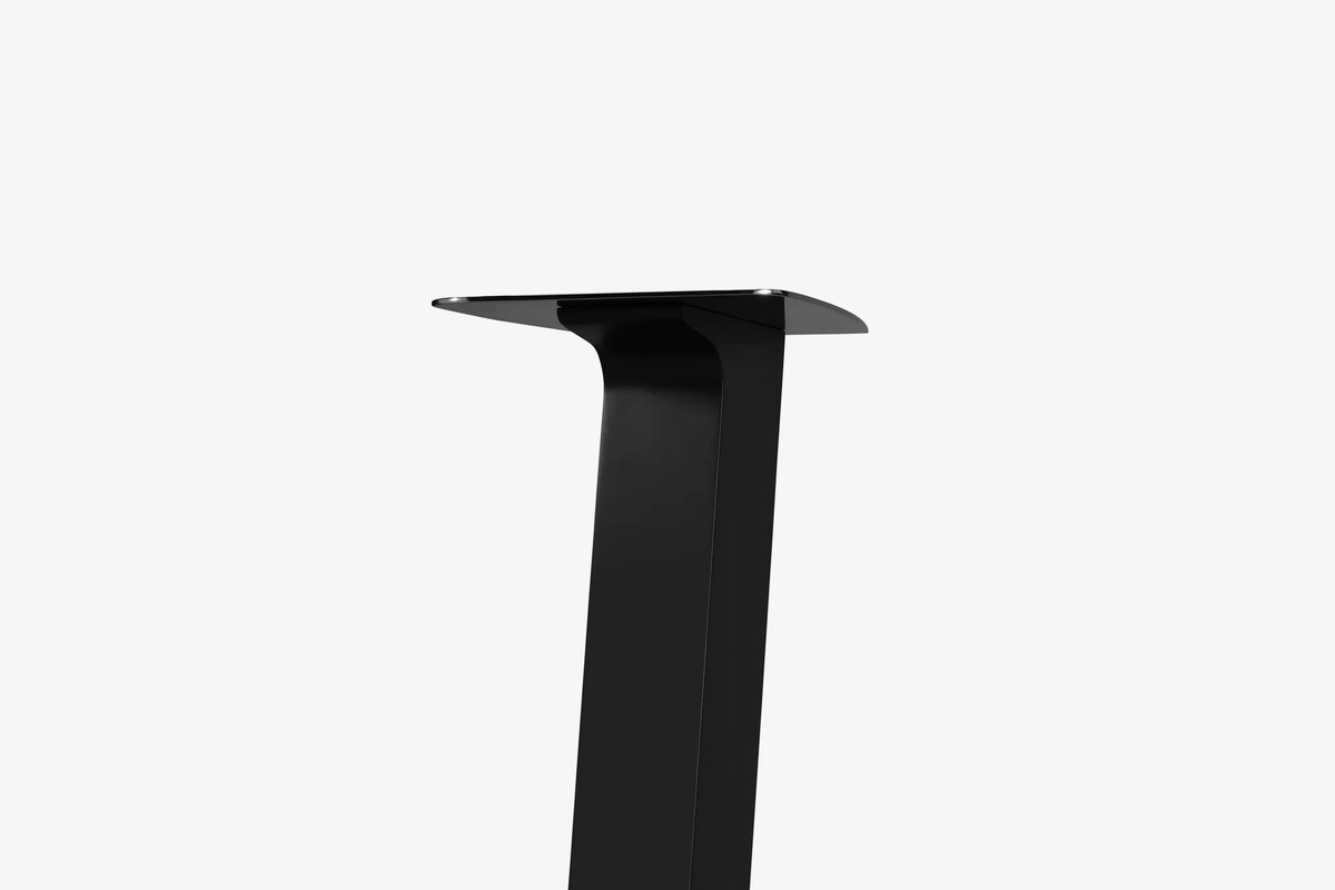 Black steel top plate and upper column of a stand, three-quarter view