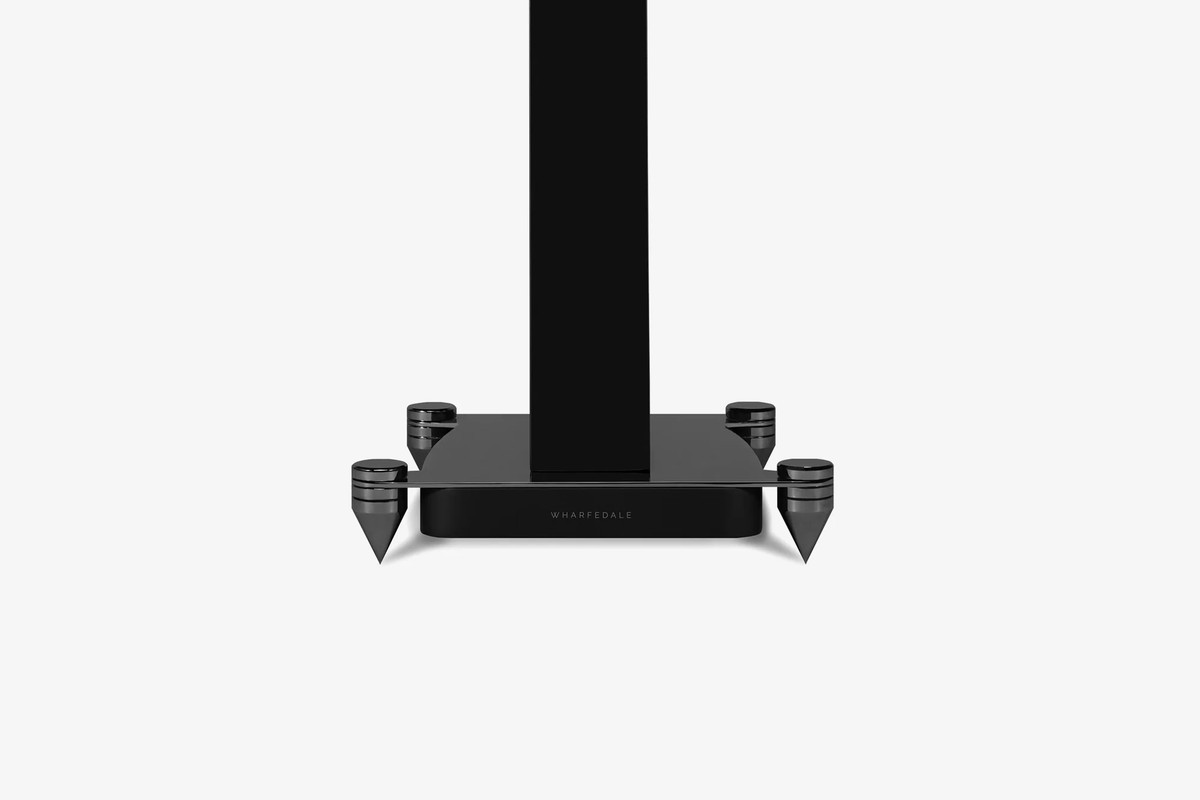 Black base of a stand with its metal spikes, front view