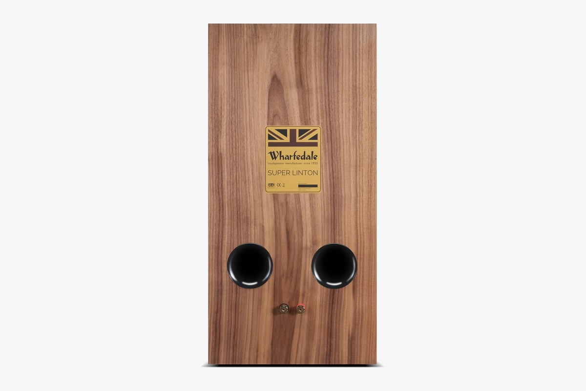 Back of a walnut speaker with its two ports and binding posts