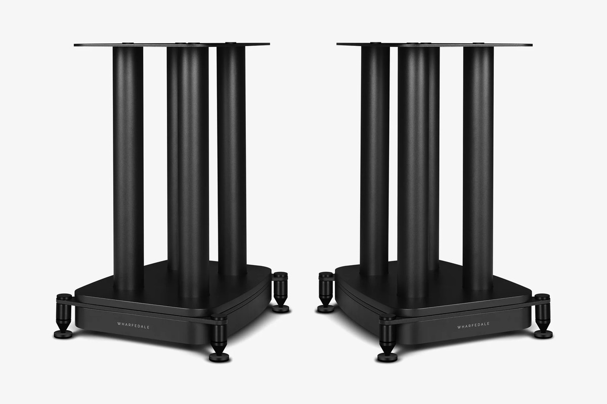 Two black speaker stands side by side, seen at three-quarter angle