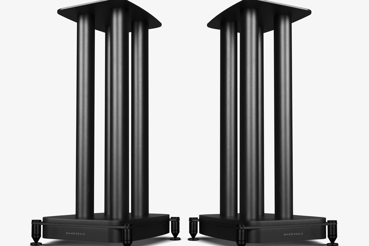 Two black speaker stands side by side, seen at three-quarter angle