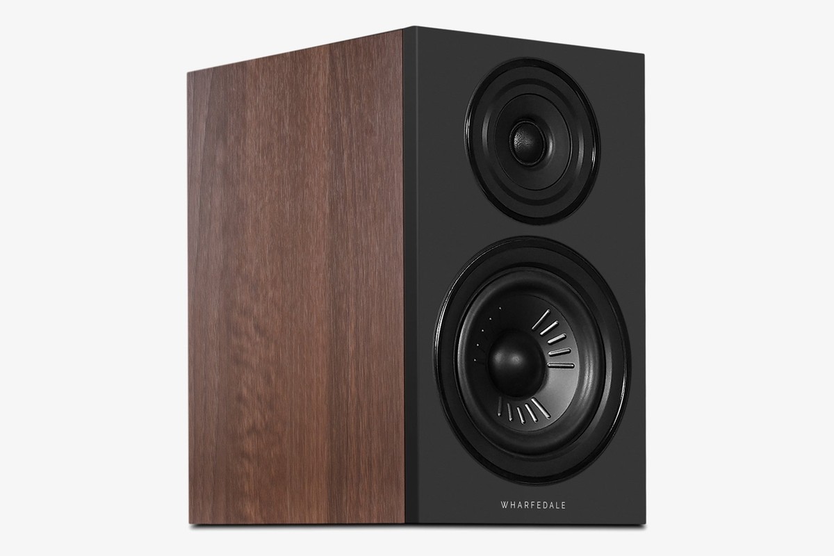 Walnut speaker with a black baffle seen at three-quarter angle