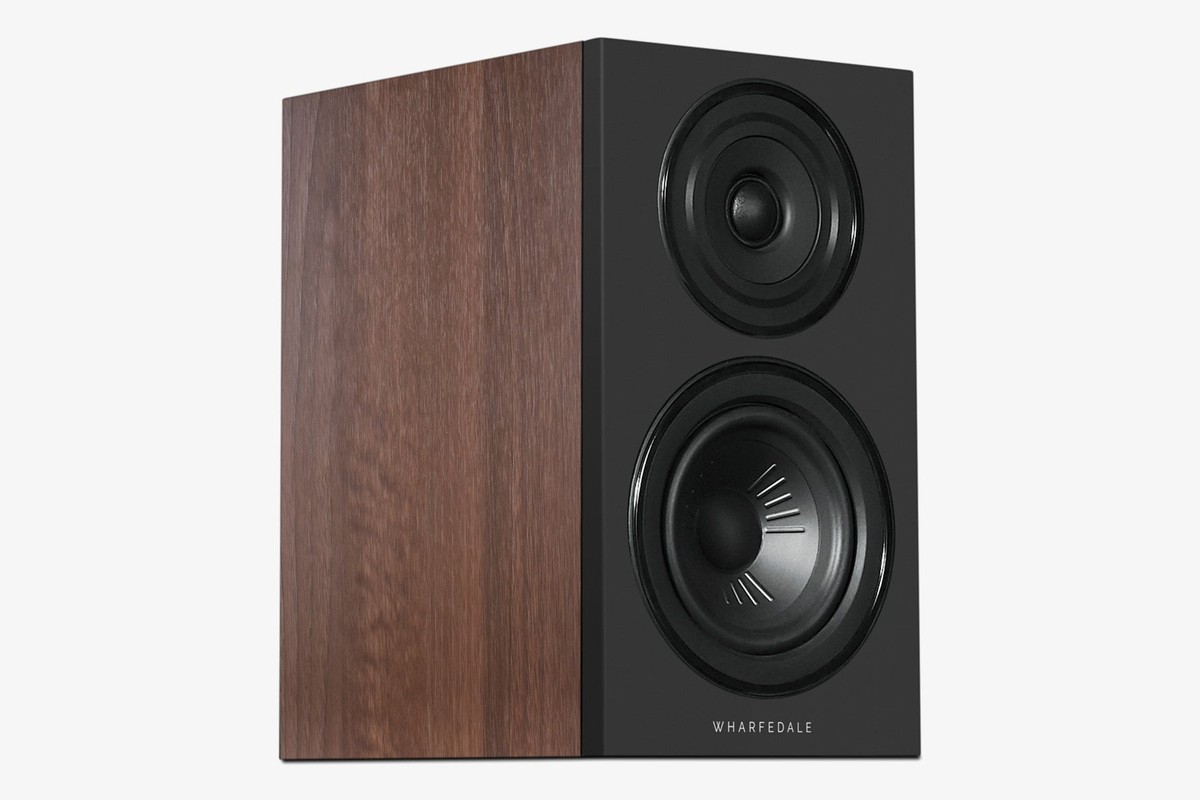 Walnut speaker with a black baffle seen at three-quarter angle