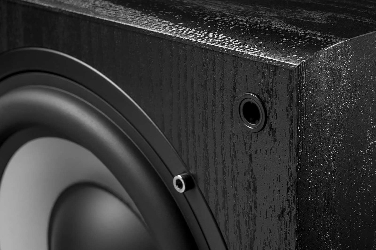 Corner of the black cabinet and edge of the driver