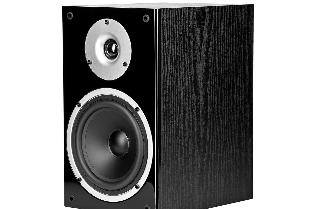 Black bookshelf speaker seen from three quarters, dome tweeter and mid-woofer on the front