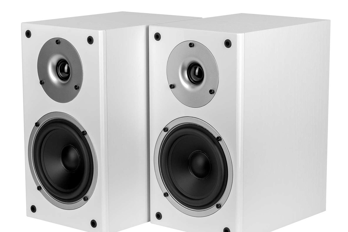 Pair of white bookshelf speakers seen from three quarters