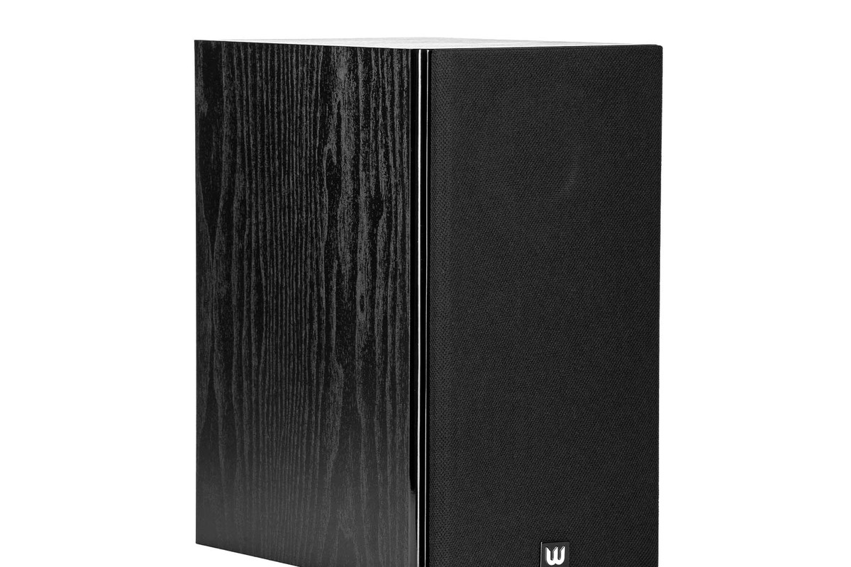 Black wood-grain cabinet seen from three quarters, with black fabric grille