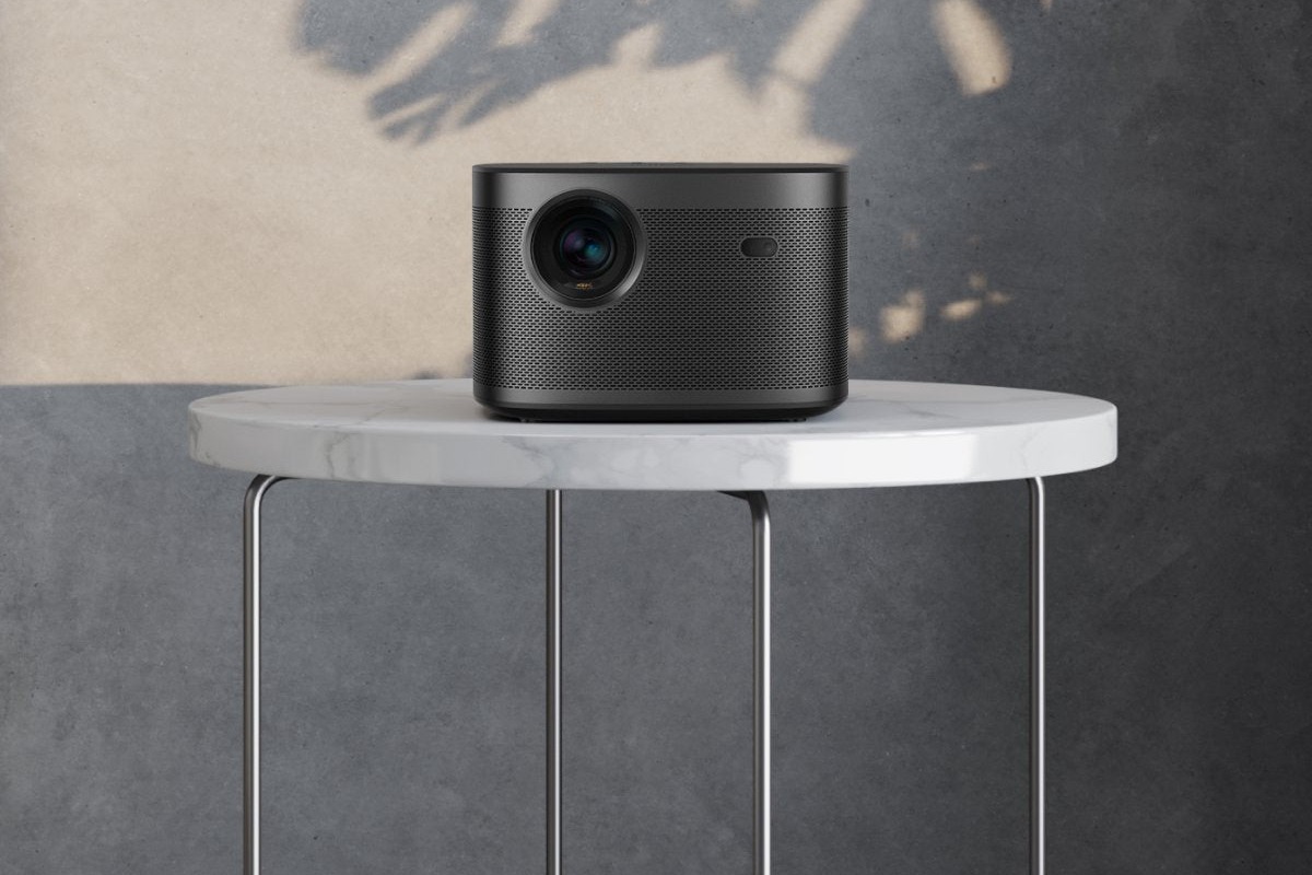 XGIMI HORIZON Pro on a marble table in a living room