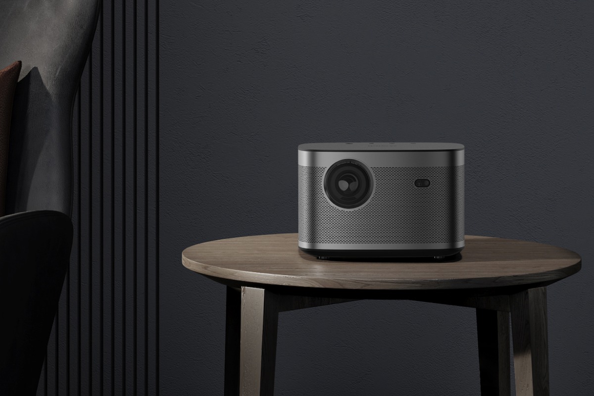 XGIMI HORIZON on a side table against a dark wall