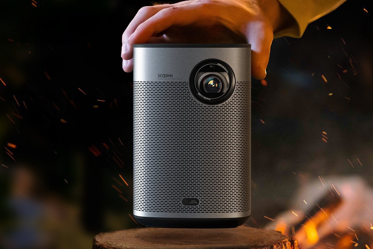 XGIMI Halo+ outdoors beside a fire