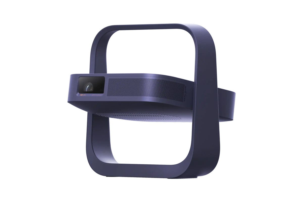 Projecteur compact violet vu de trois quarts, pied-poignée déplié