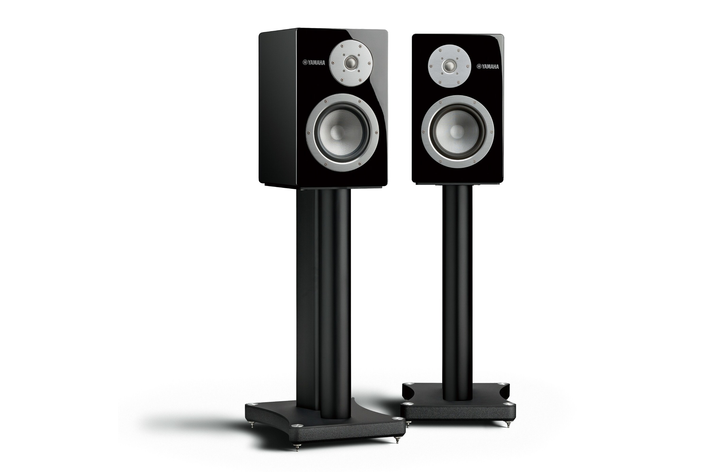 Pair of black speakers side by side on a light background