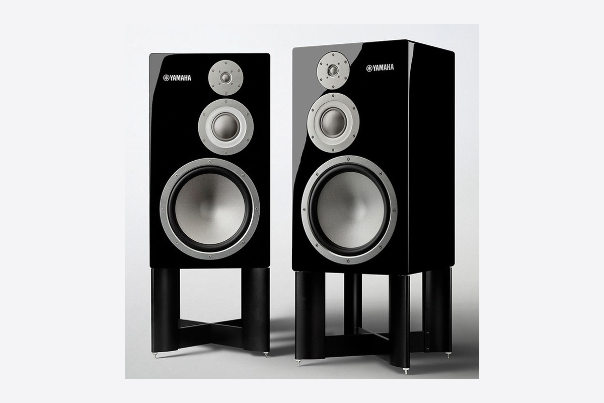 A pair of NS-5000 on their dedicated stands, seen at three quarters